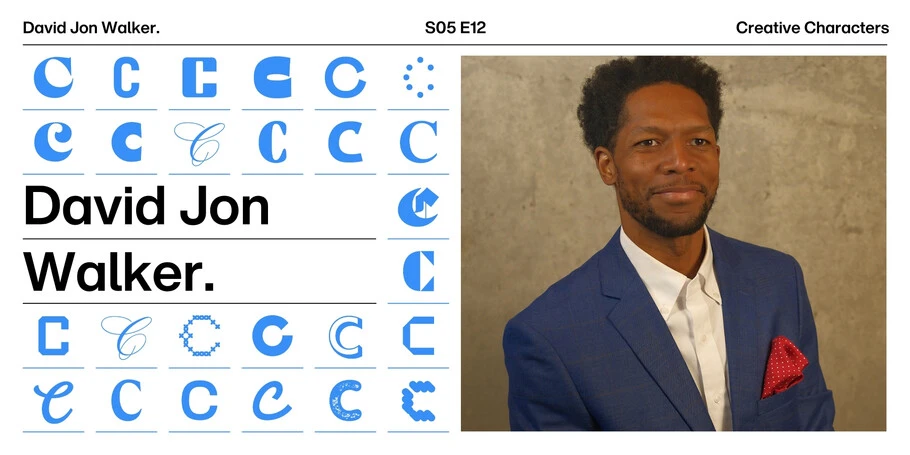 Headshot of David Jon Walker in a blue suit coat with red handkerchief 